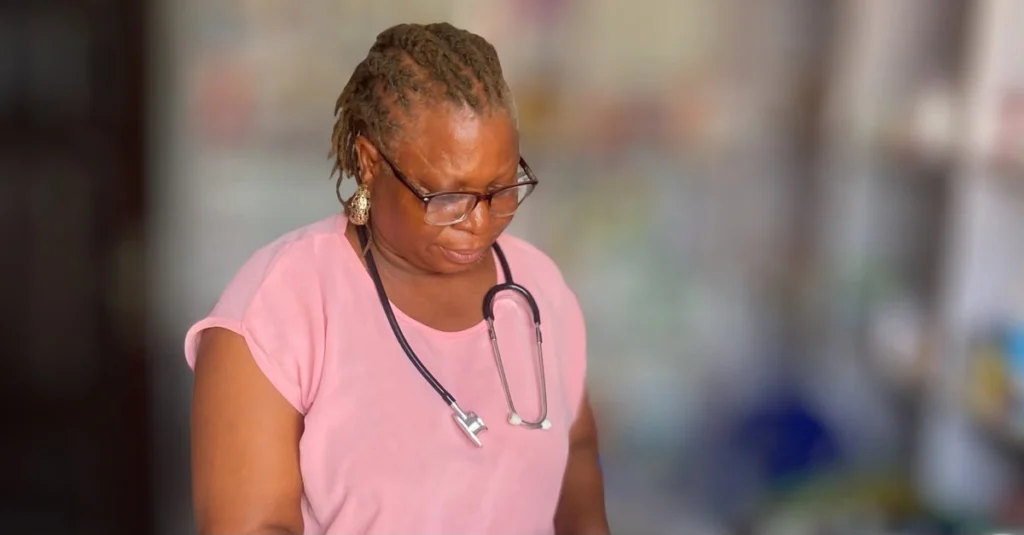 Silver giving health tips while preparing prescriptions