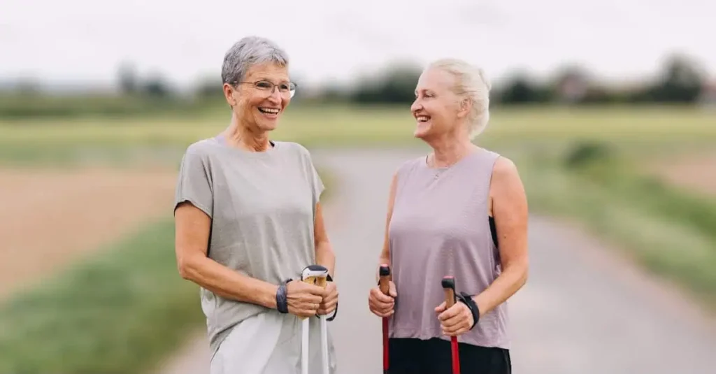 Two older women resting after walking to enjoy the health benefits of walking every day