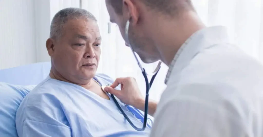 Doctor checking a man’s heart with a stethoscope for poor blood circulation