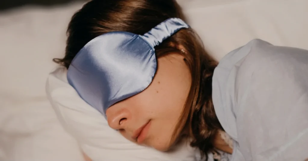 How Much Deep Sleep Do You Need? Close-up of woman sleeping with a sleep mask