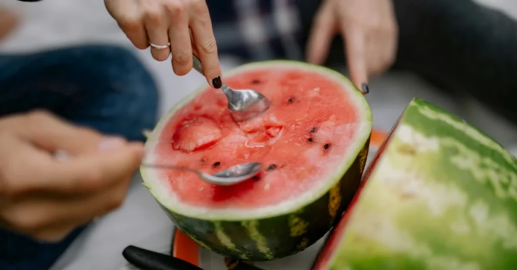 How to develop healthy habits: A couple eating watermelon as part of developing healthy eating habits