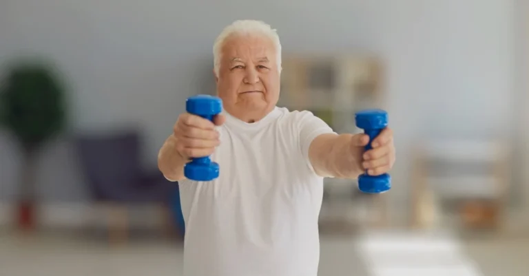 Elderly man performing a dumbbell front raise to demonstrate the benefits of physical activity